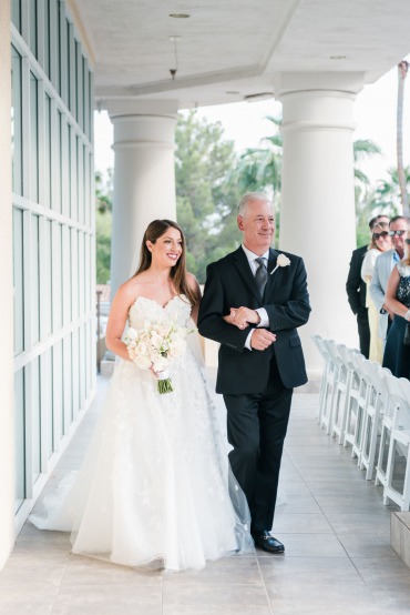 Bride walks down the aisle with her father