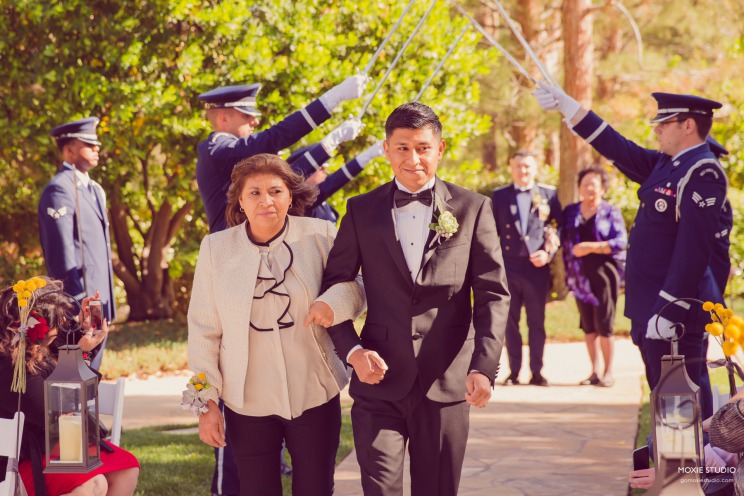 Two Grooms Escorted by Moms