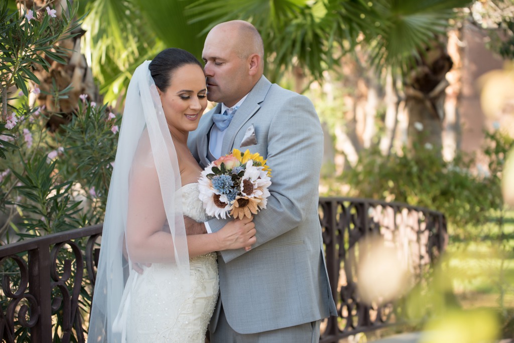 Las Vegas Groom kisses his lovely bride on the forehead at reflection bay golf club