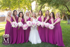 Bride with bridesmaids in purple gowns