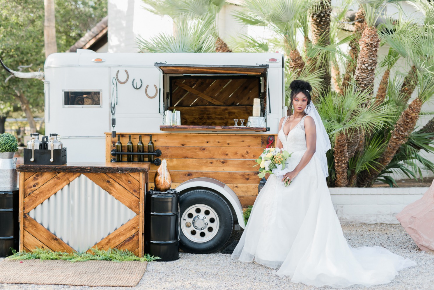 Bride at The Farm in Brillian Bridal Gown with mobile bar.