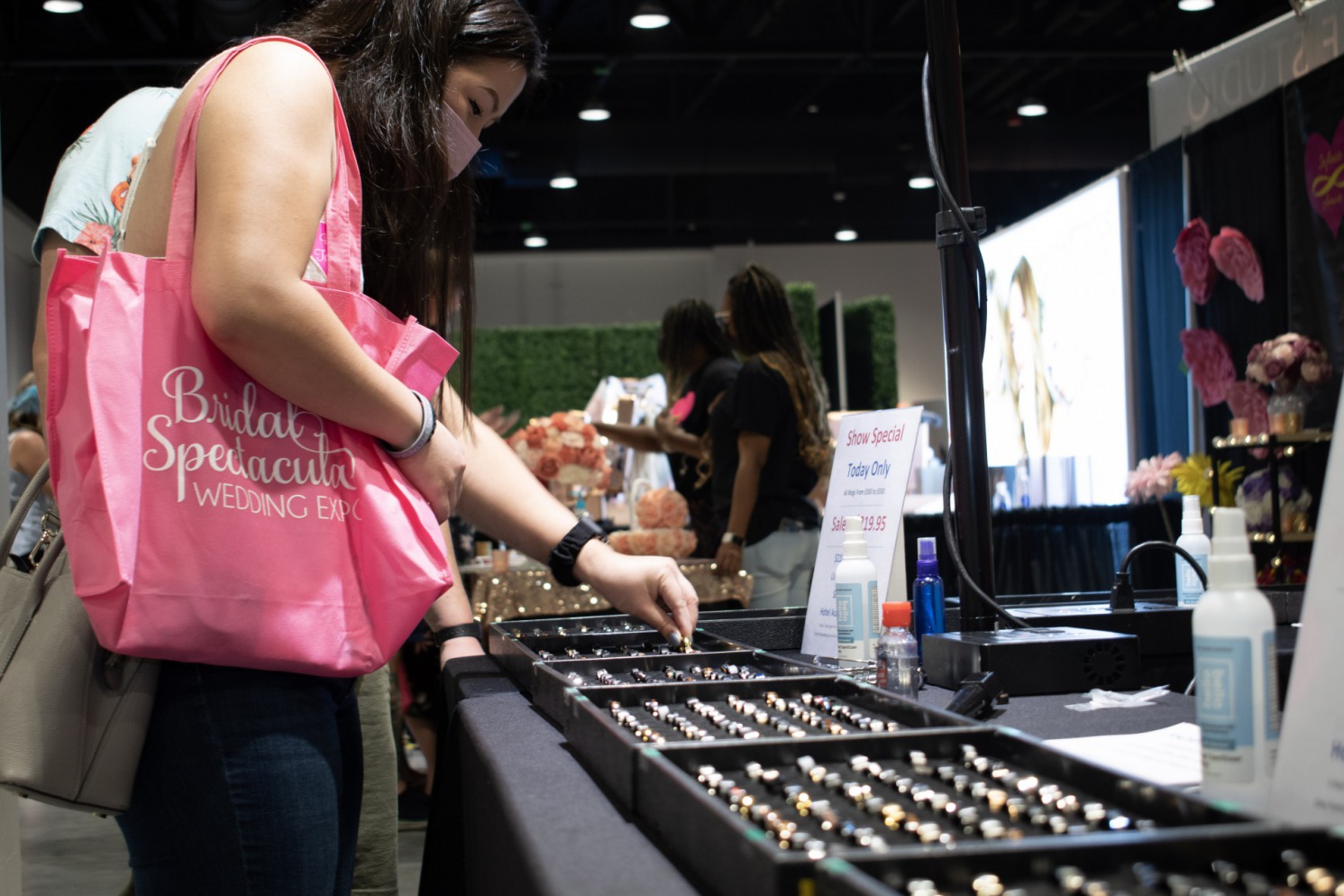 Bride to Be shops for men's wedding bands at Las Vegas Bridal Spectacular Wedding Expo for Las Vegas Wedding Professionals