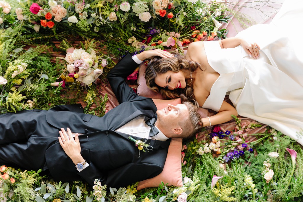 Bright flowers with bride and groom