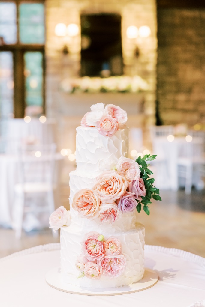 Lovely White cake with roses for decor at a Las Vegas Wedding