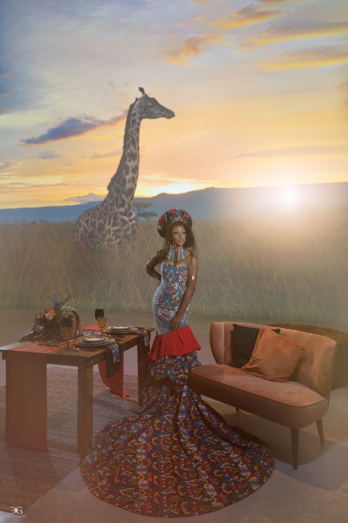 African bride in front of sweetheart wedding table with giraffe in the background