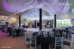 Black and White Wedding decor. What a space to celebrate your nuptials. A canopy twinkling lights over the dance floor are a perfect space for your first dance surrounded by your family seated at tables with black linens.